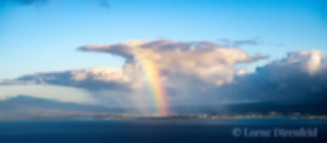 On approach to Honolulu, greeted by a rainbow . . .