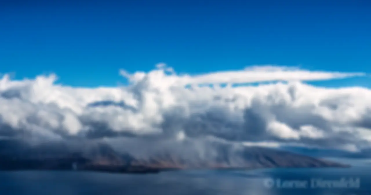 Olowalu valley in rain and mist, with clear skies above . . .