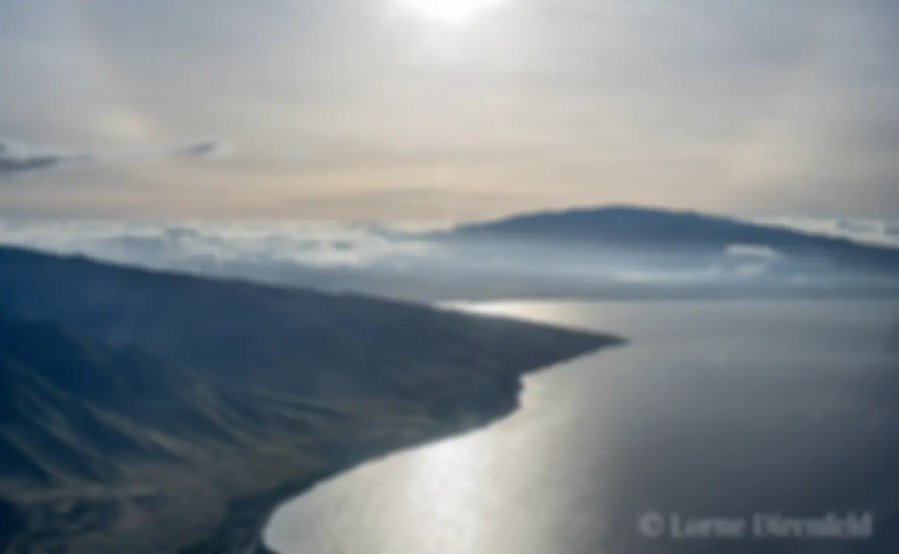 West Maui, with the Kaheawa windmills across the ridge above Maalaea, and Haleakala in the background on a hazy morning . . .