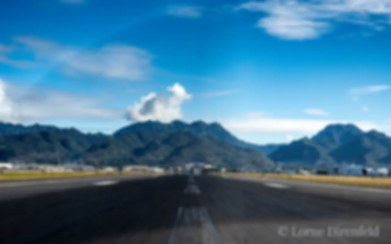 A view from the "front office," departing Honolulu on a sunny morning, with the Ko'olau mountains ahead . . .