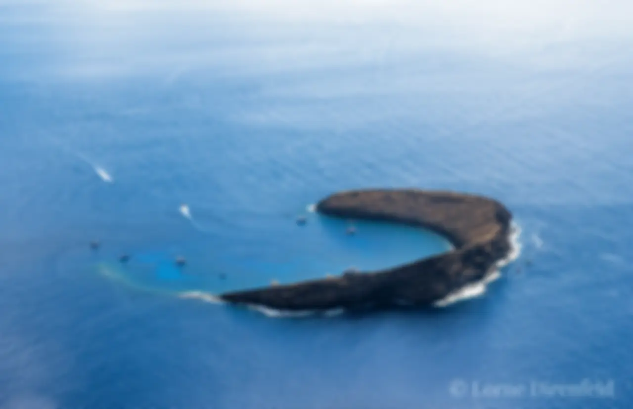 Molokini crater, back side, with snorkel tour boats on a beautiful morning . . .