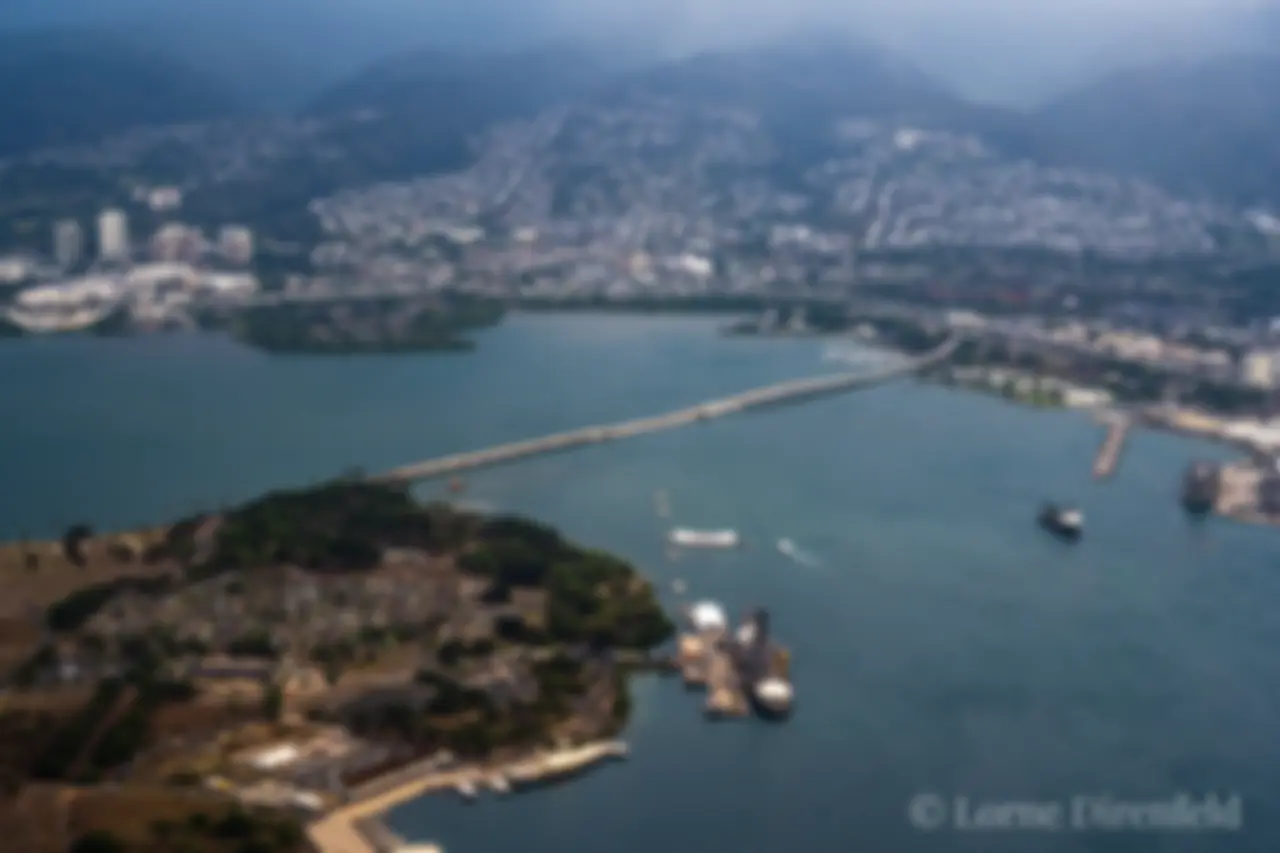 The bridge connects Ford island in Pearl Harbor to the mainland of Oahu . . . The Arizona Memorial can be seen just below the center of the image . . . The battleship Missouri is near the center lower part of the image . . .