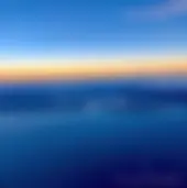 From 10,000 feet, looking to the north and Pearl Harbor, with the reef runway offset from the rest of the island . . ..  . .