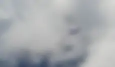 A Cessna 208 Caravan passing below, at 10 moving to 9 o'clock . . .