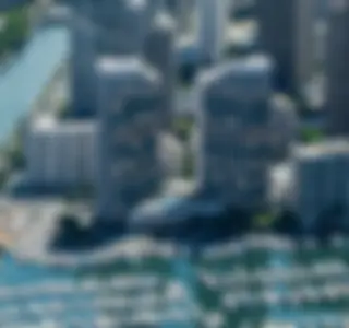The gleaming windows of the Waikiki Prince Hotel overlook the Ala Wai small boat harbor . . .