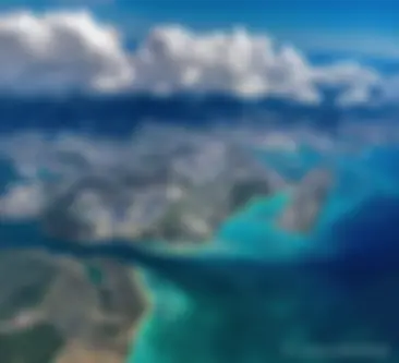 Looking down from 9000 feet, in the late morning at the Honolulu airport and the beautiful blue ocean . . .