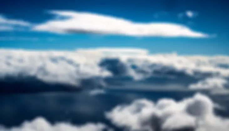 On approach to Maui, from the south, at about 6000 feet, with a lower layer of clouds . . .