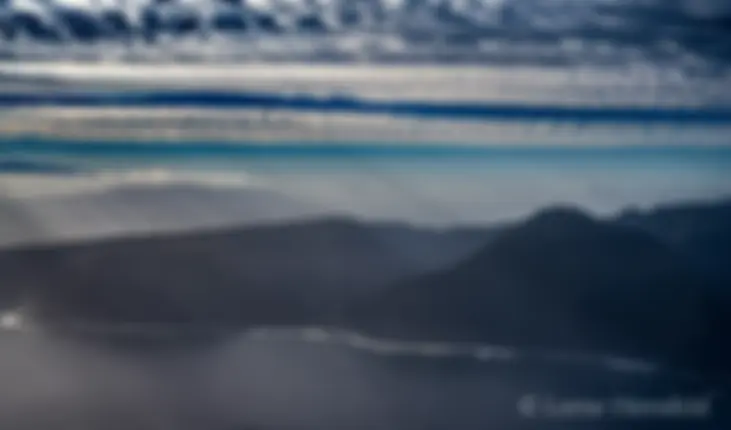 Molokai, north shore, tall sea cliffs in the early morning, with Maui in the background, upper left . . .