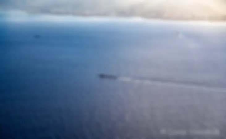 A submarine returns to Pearl Harbor . . .