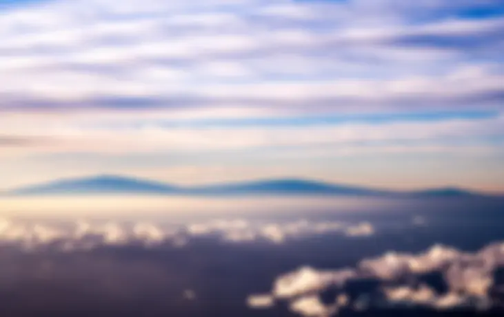 Mauna Kea, Mauna Loa and Hualalai mountains on the Big Island of Hawaii in the early morning . . .