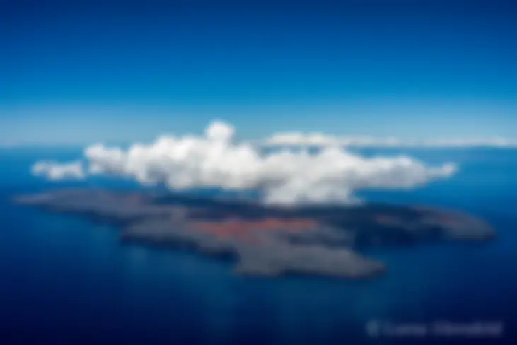 Kaho'olawe in the late morning, with a cover of convective clouds, as seen from about 5000 feet, from the northeast. This photo has been selected for the permanent archives of the State of Hawaii . . .