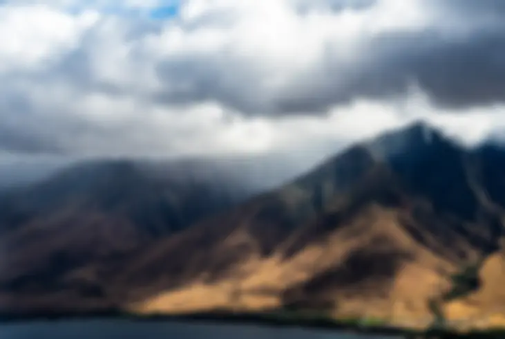 Olowalu valley is filled with low clouds, but there has been little rain and the ground is dry and brown .. .